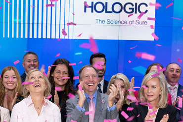 Hologic leadership celebrating among confetti.