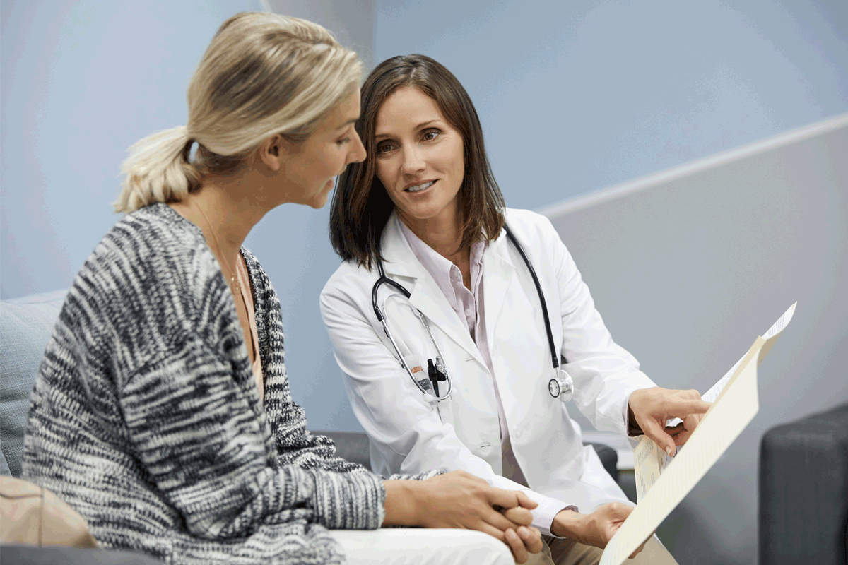 A doctor shares results with a patient.