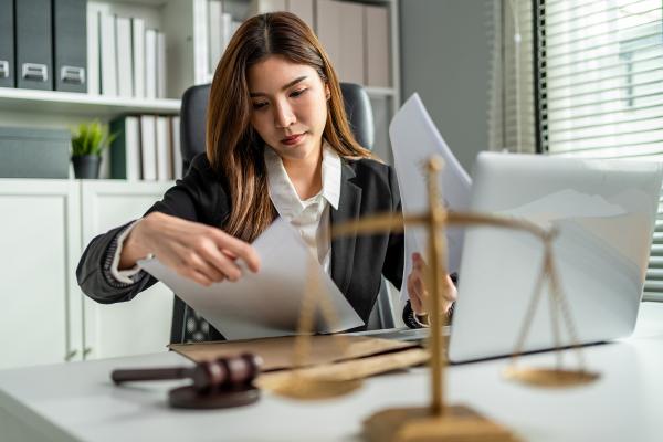 Business woman reviewing legal documents
