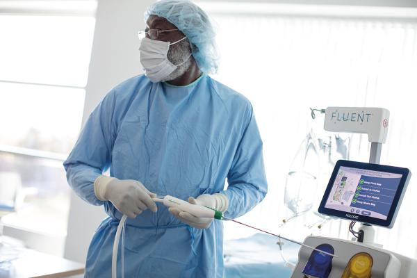 Hologic lab technician using a Hologic medical device