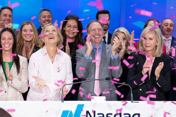Hologic and WTA partners at NASDAQ with pink confetti