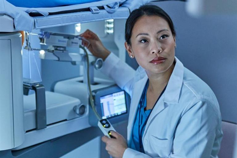 Healthcare professional handling medical equipment