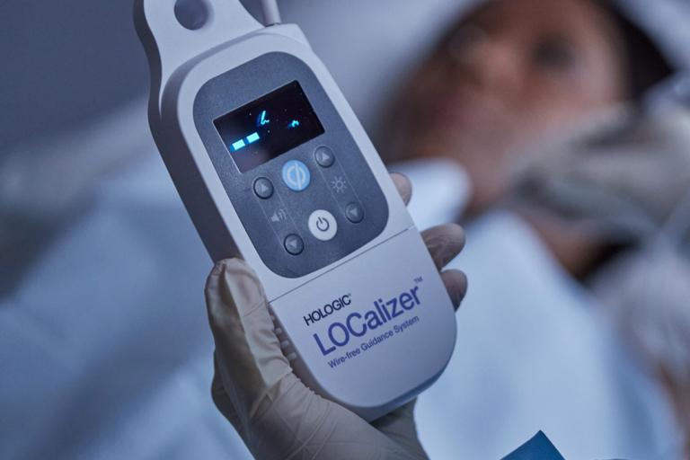 Healthcare professional handling medical equipment