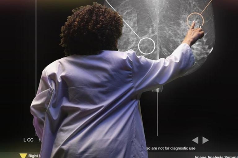 Healthcare professional pointing to xray