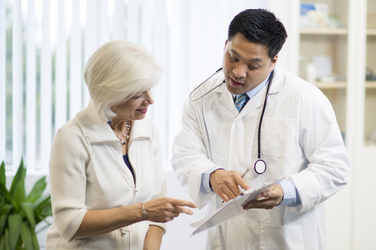 Patient speaks with healthcare provider in clinic setting
