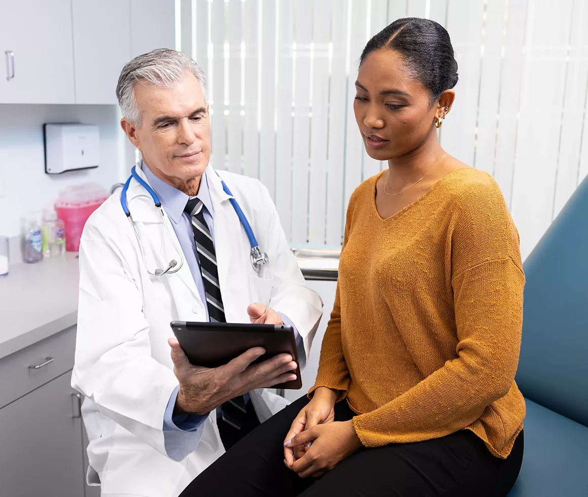 Doctor and patient reviewing lab tests