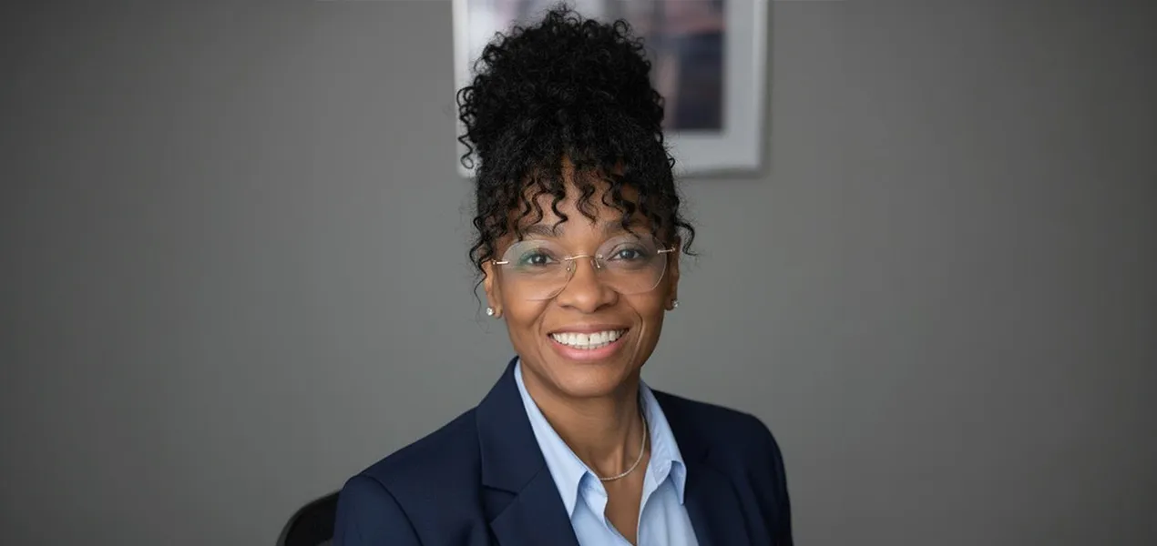 Woman smiling in office setting.
