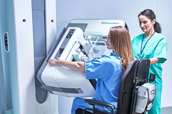 Patient getting an exam by healthcare provider in lab setting.