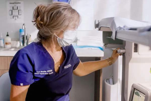 Physician working with medical machine