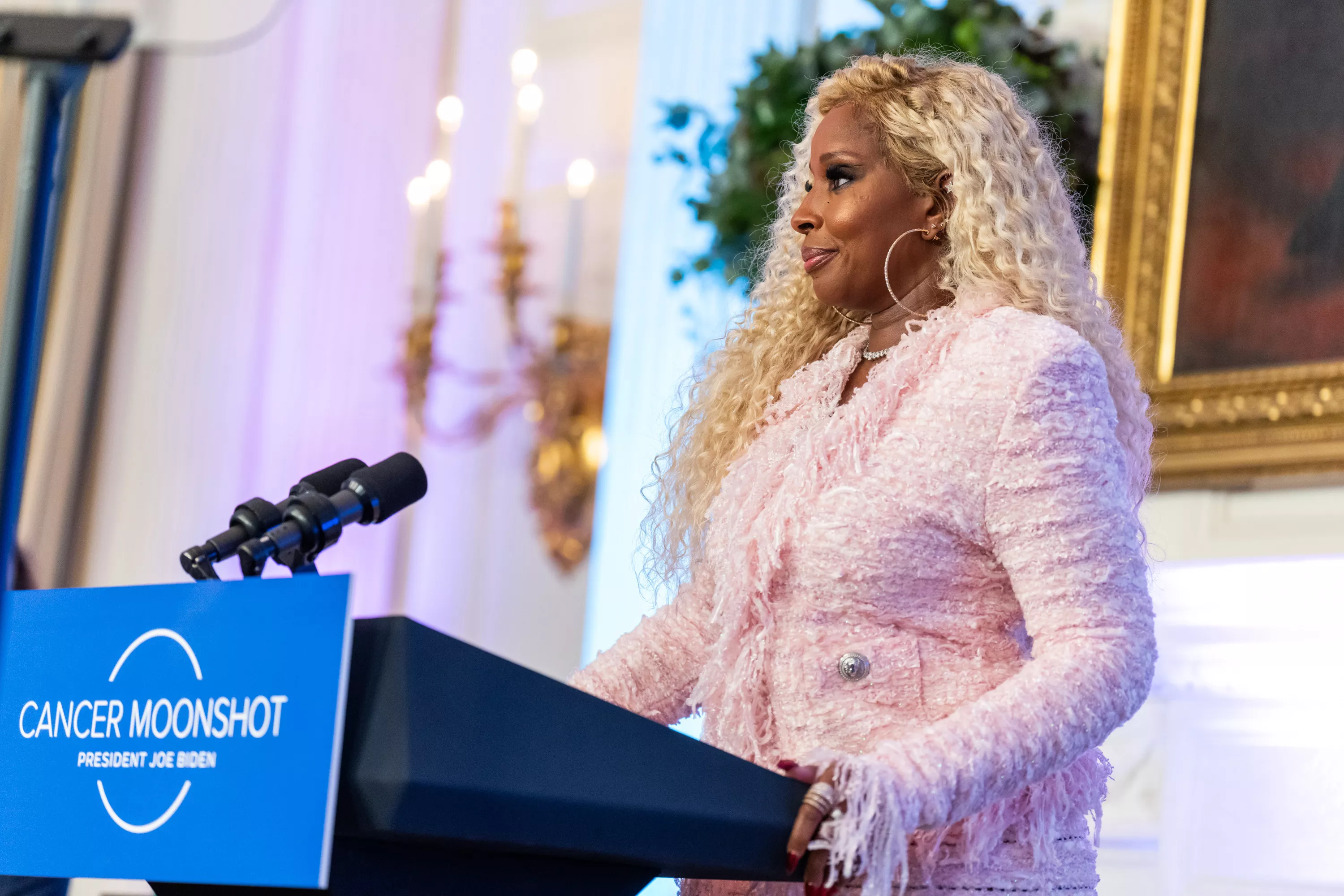 Mary J. Blige standing at a podium speaking at The White House.