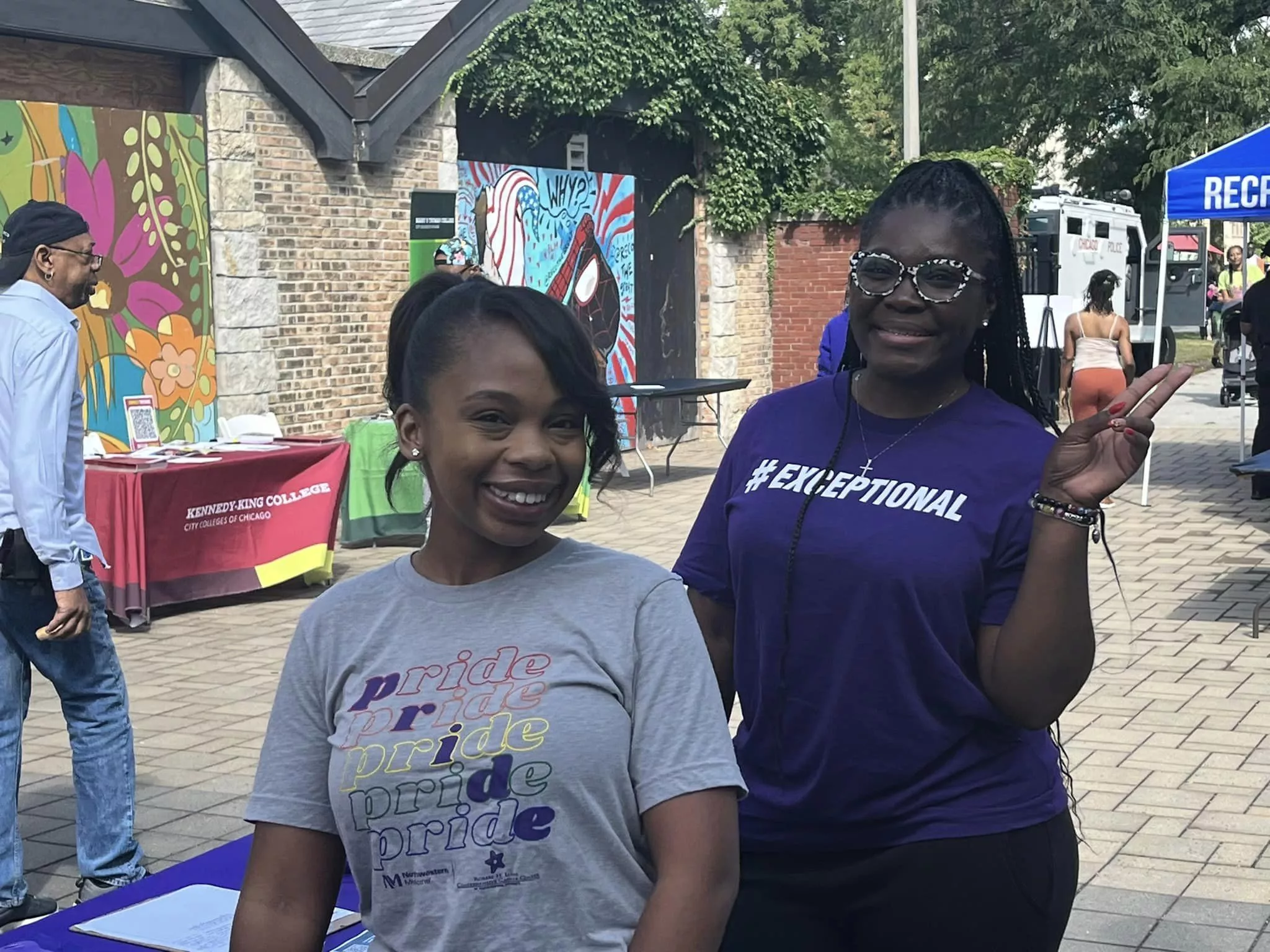 Two women smiling outside.