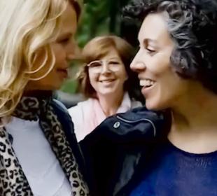 Women smiling and laughing outside