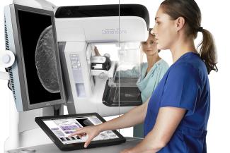 Patient having a Genius 3D MAMMOGRAPHY exam 3 x 5 300 dpi