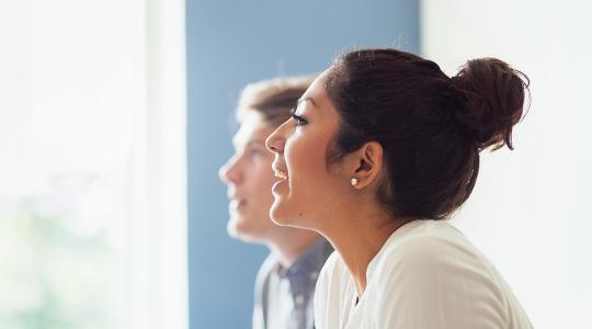woman talking animatedly in office
